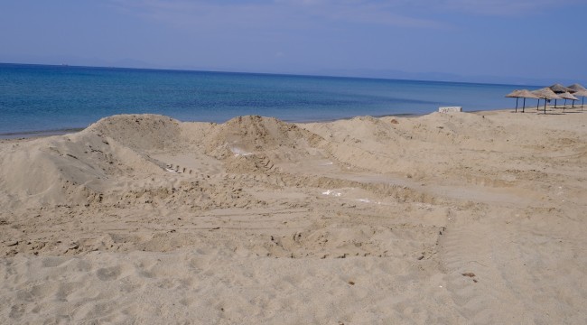 DÜNYACA ÜNLÜ SARIMSAKLI'NIN PLAJ KUMLARINA YAZIK OLUYOR